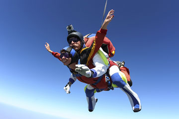 a skydiving instructor and student